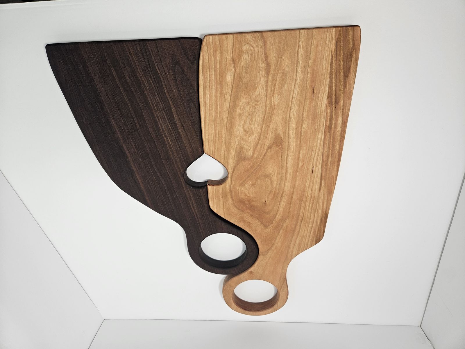 Heart-shape nesting charcuterie board set — two boards that nest together, forming a heart cut-out where they join