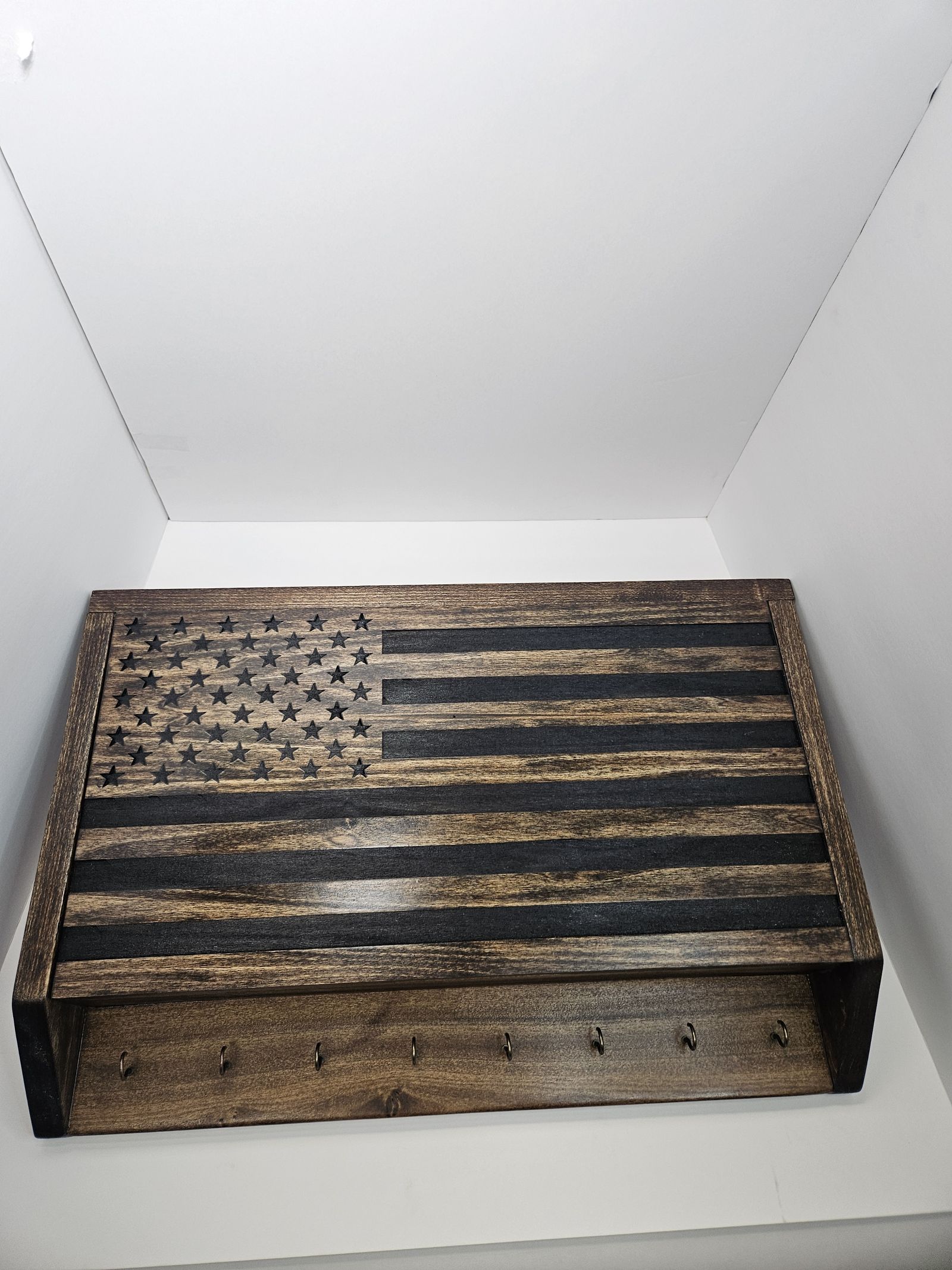 Wooden flag-front concealment box with a storage shelf